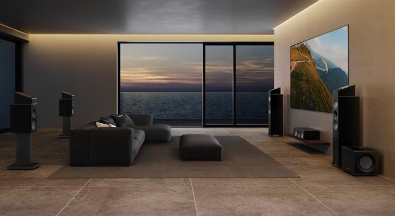 KEF soundbar positioned beneath a wall-mounted TV in a modern living room for an immersive home cinema experience