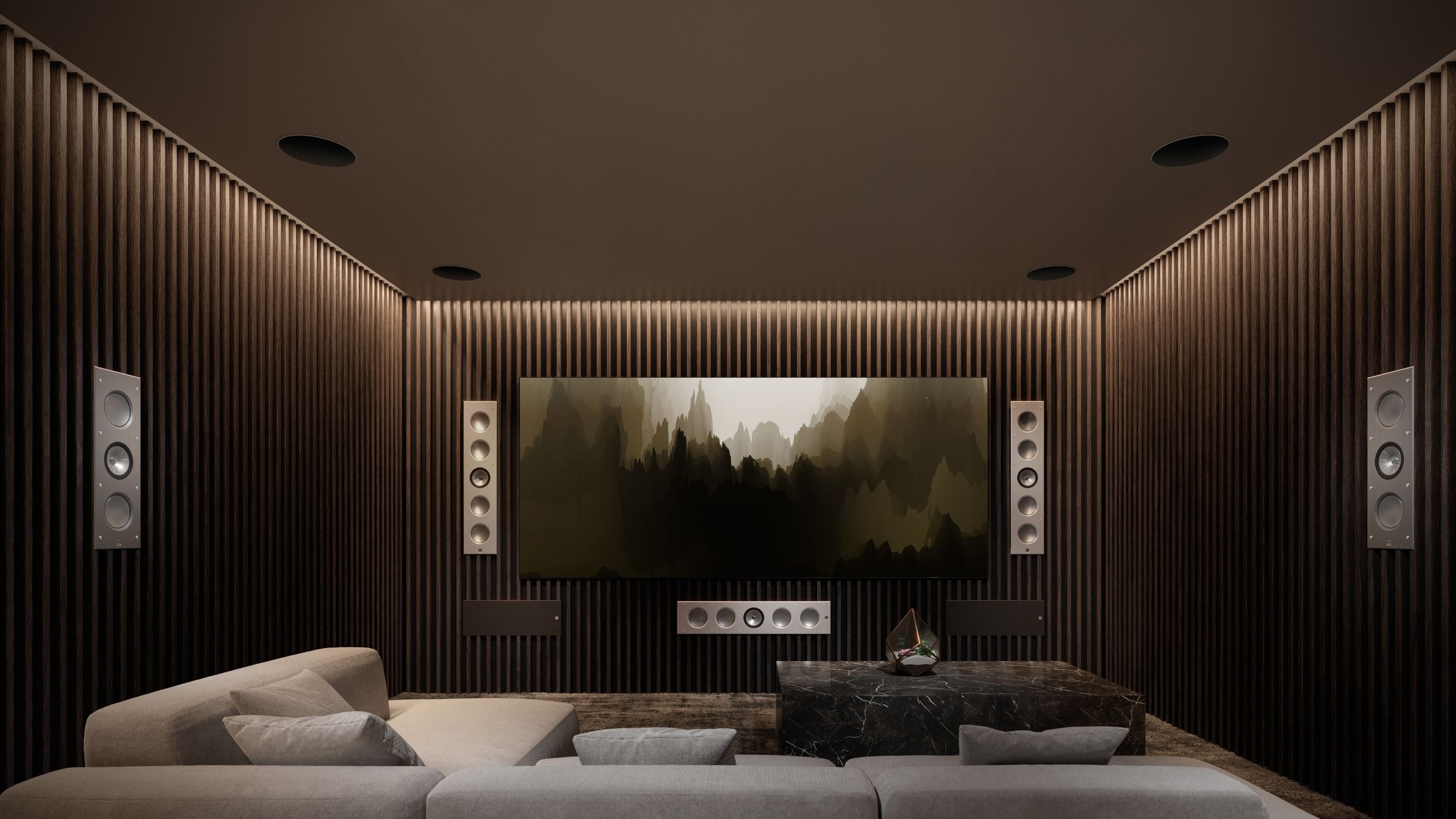 A modern home theater featuring a large screen and KEF two architectural speakers models: Ci5160RLM-THX (large) and Ci3160RLM-THX (small).