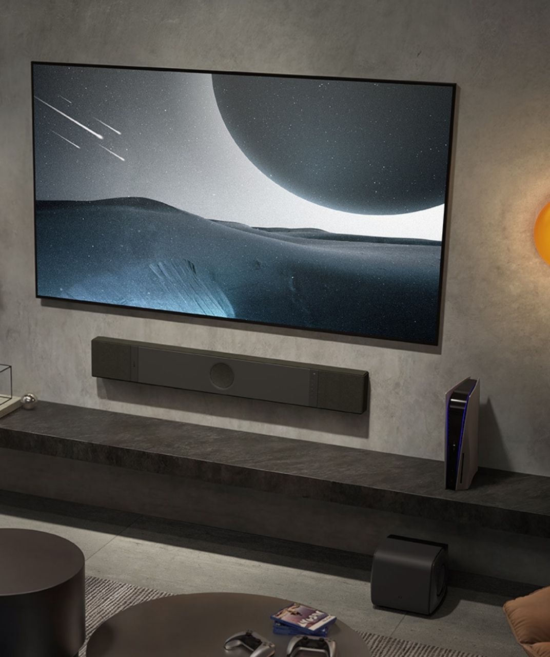 Modern living room with a large TV displaying a space scene, soundbar, games console and subwoofer.